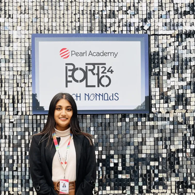 Nanditha at Pearl Academy's Portfolio 24 show, standing in front of a sequinned wall.