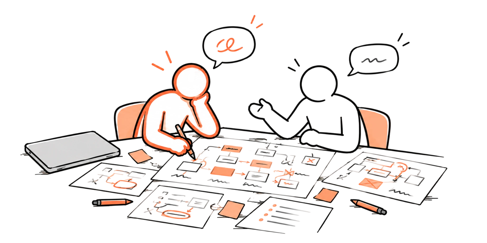 Two designers at a table covered in hand-drawn maps of the product, a closed laptop pushed to one side.